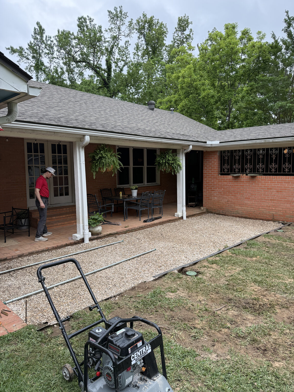 Compacted base prepared for a checkerboard paver patio in East Texas
