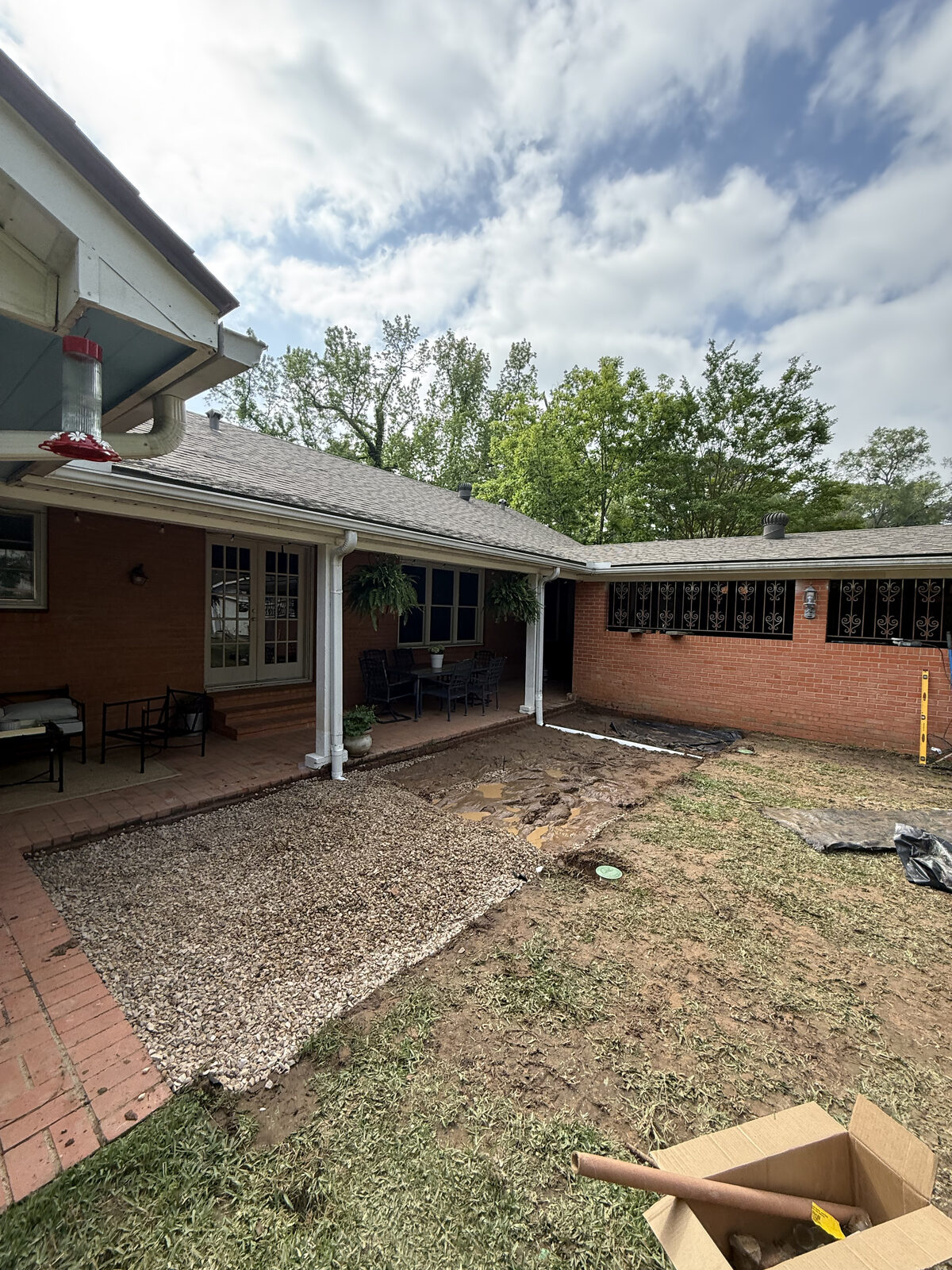 Backyard cleared and graded for a paver patio installation in East Texas