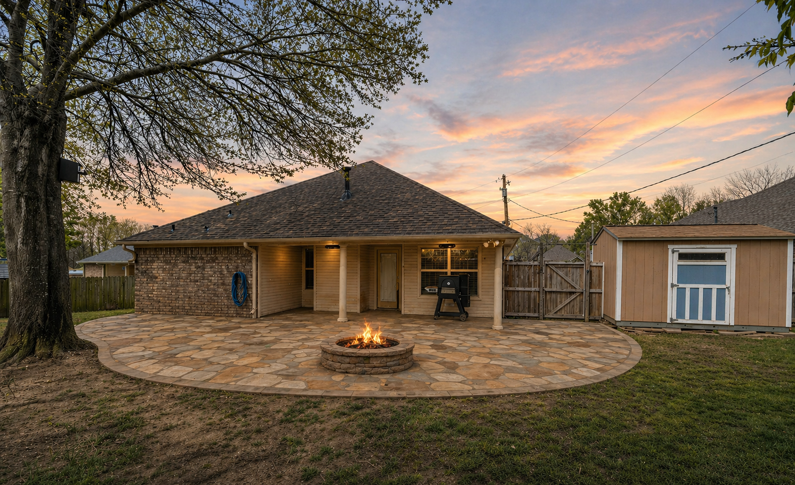 Yard Dog Landscapes design rendering for a backyard flagstone patio with a custom fire pit and seating area