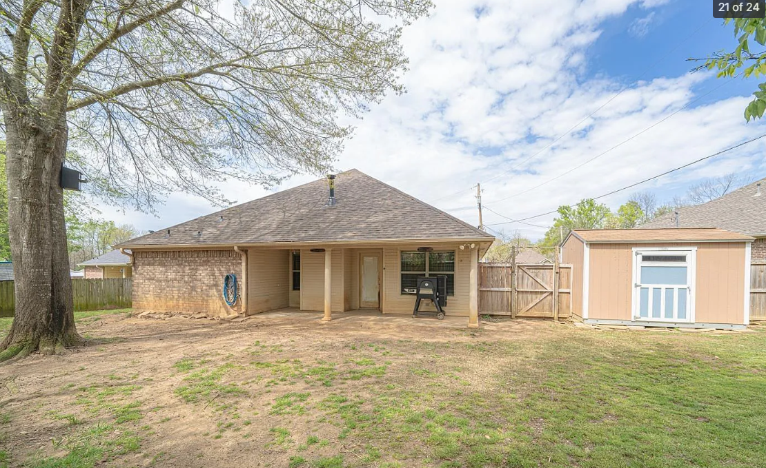 Backyard before flagstone patio and fire pit installation