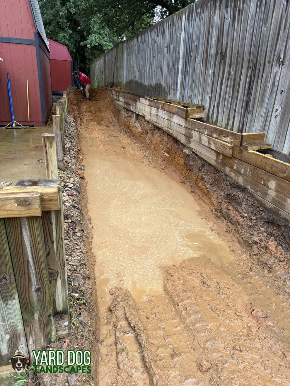 Demolition and excavation of an old wood retaining wall in East Texas