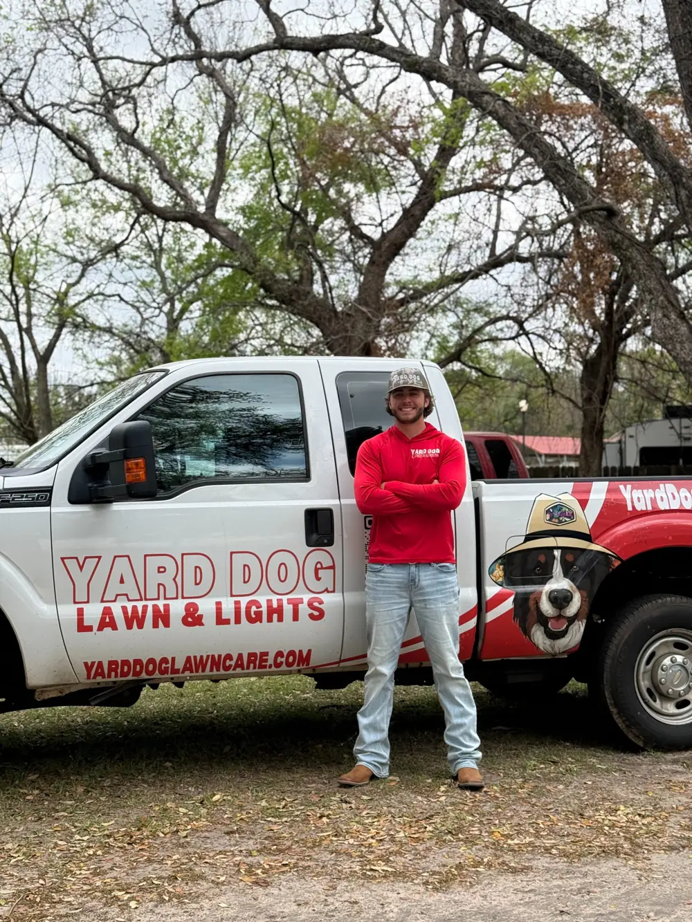 Miller Maines, owner of Yard Dog Landscapes, in front of a Yard Dog truck