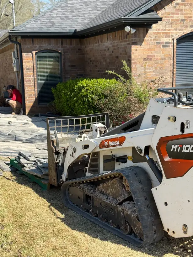 Bringing flagstone in with the loader, East Texas