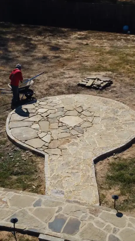Round flagstone seating area at the end of the walkway, from above, Kilgore, TX