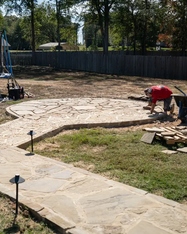 Fitting flagstone where the seating area meets the walkway, Kilgore, TX