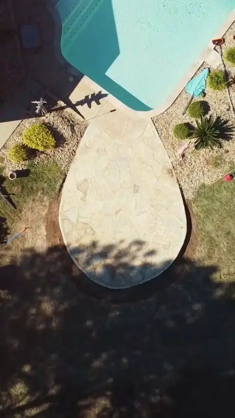 Rounded flagstone patio and stone border, from above, Hallsville, TX