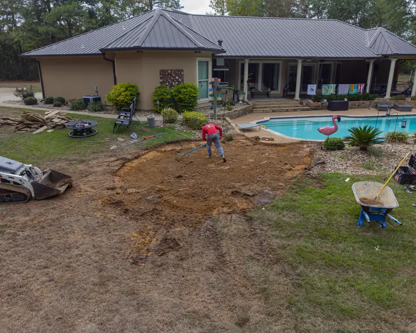 Aerial view of the patio being dug out beside the pool, Hallsville, TX