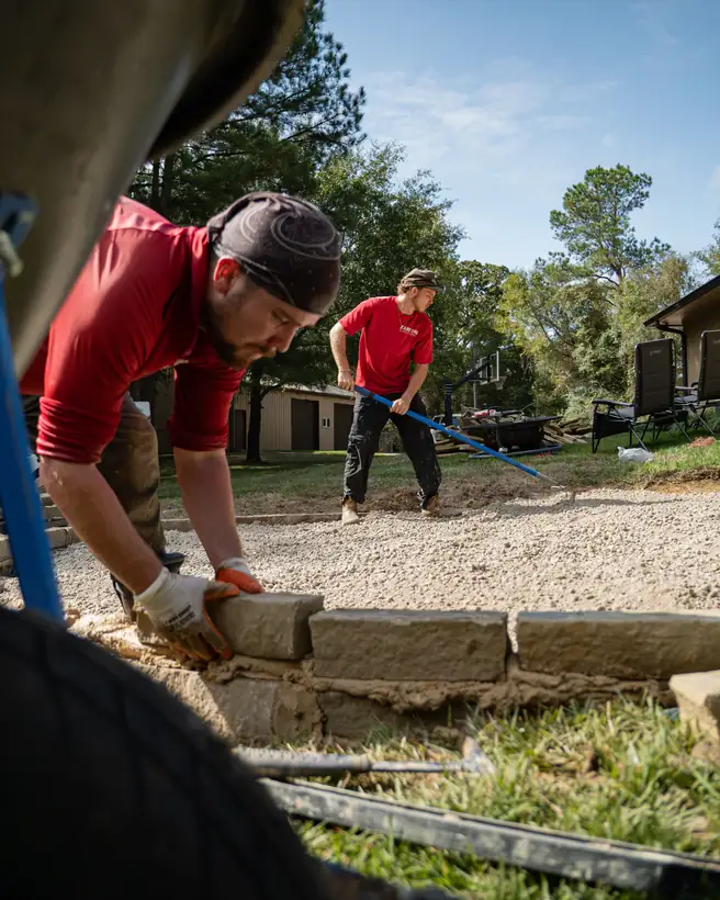 Setting border stones beside the limestone base, Hallsville, TX