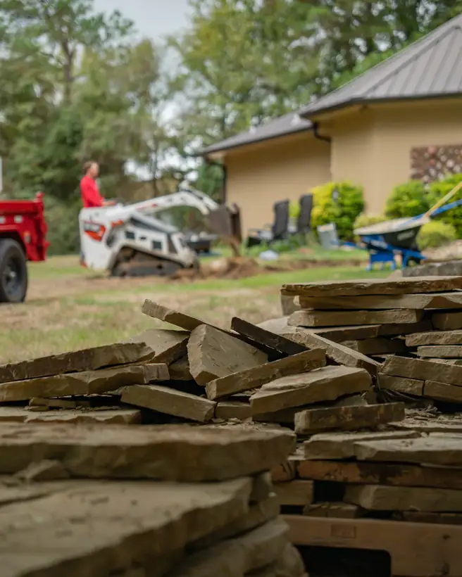 Flagstone pallets staged by the house, Hallsville, TX