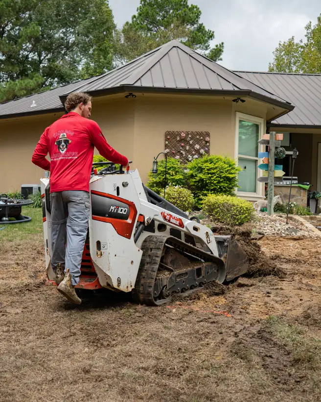 Track loader working the patio area, Hallsville, TX