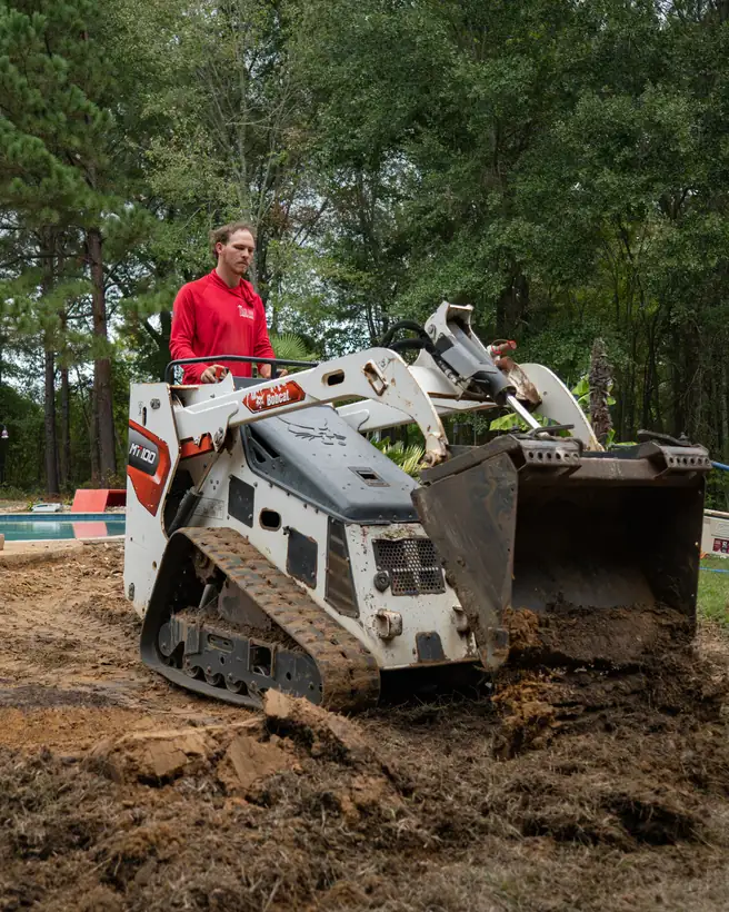 Mini track loader digging out the patio area, Hallsville, TX