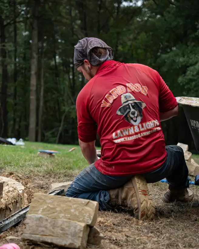 Sorting chopped stone for the border, Hallsville, TX