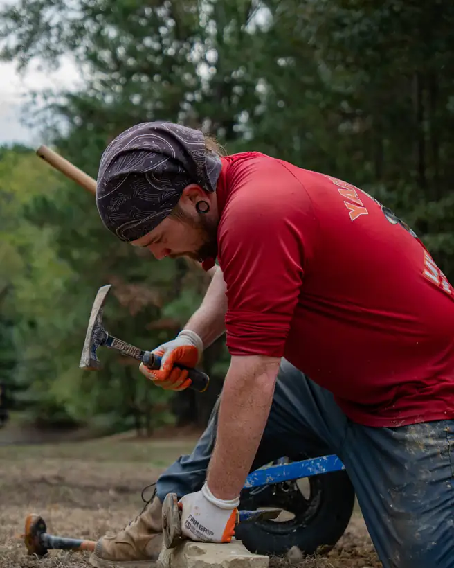 Shaping a border stone with a hammer, Hallsville, TX