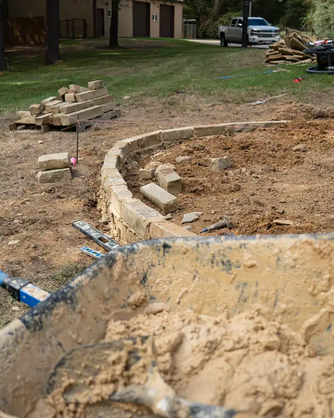 Curved chopped stone border taking shape, Hallsville, TX