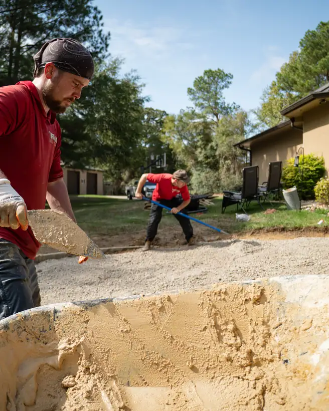 Scooping mortar for the border as the base is raked out, Hallsville, TX