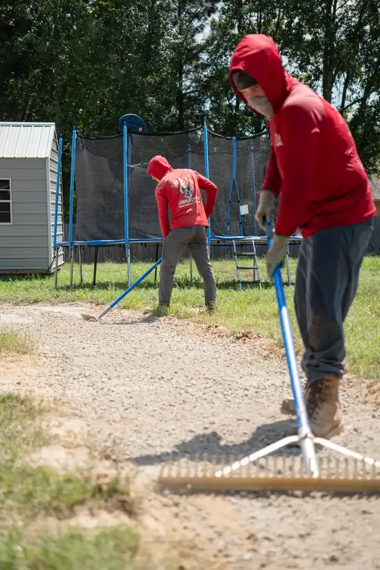 Spreading base gravel for the walkway, Kilgore, TX