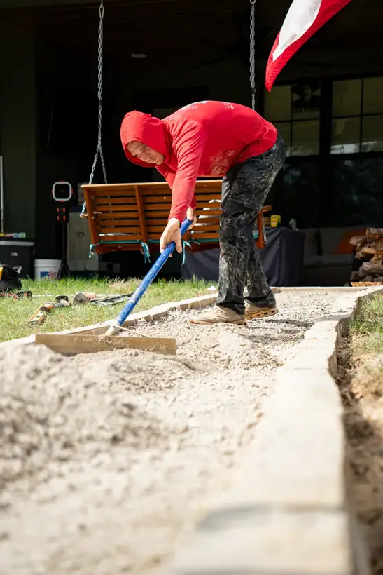 Fitting flagstone along the border, Kilgore, TX