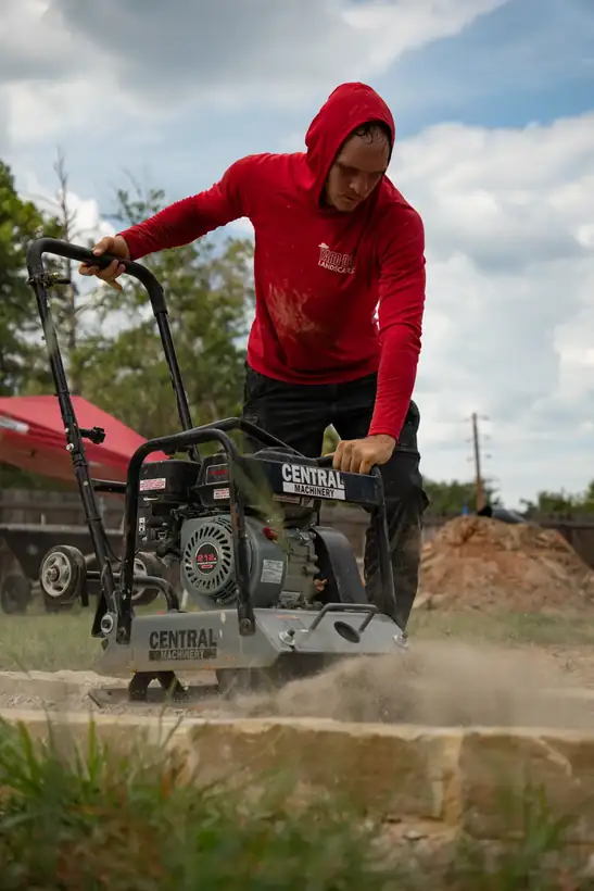 Plate compactor on the walkway, Kilgore, TX