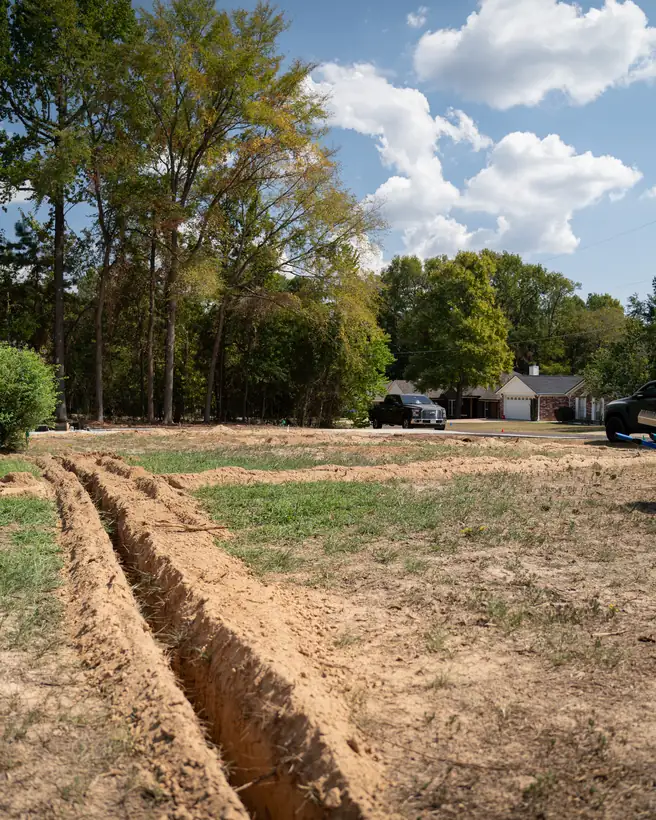 Trench lines running across the yard, Longview, TX