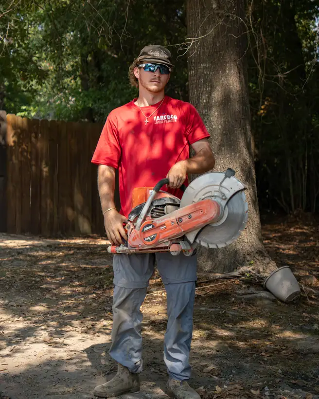 Crew member with the concrete saw, Longview, TX