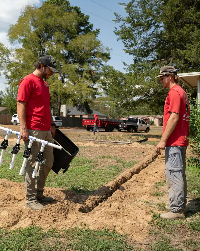 Carrying a valve manifold out to the trench, Longview, TX