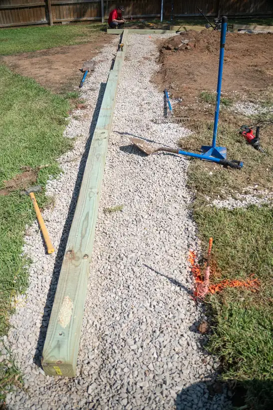 Timber wall lined up along the pad edge, White Oak, TX