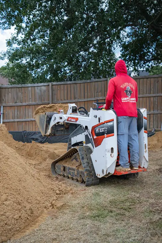 Track loader spreading fill, White Oak, TX