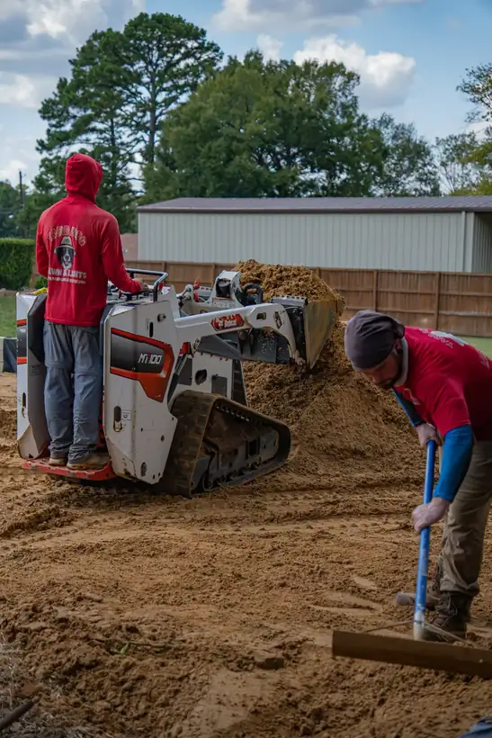 Crew working alongside the loader, White Oak, TX