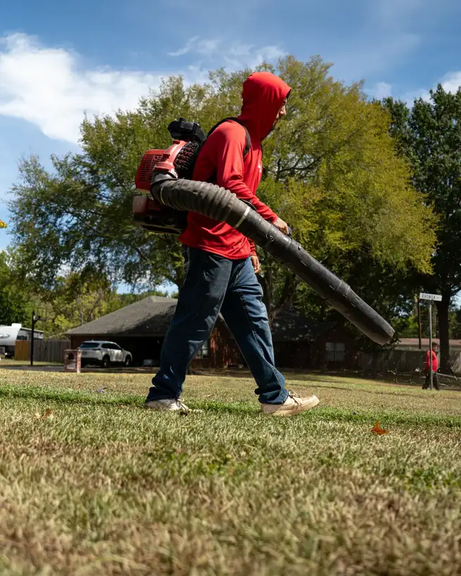 Blowing off clippings, East Texas