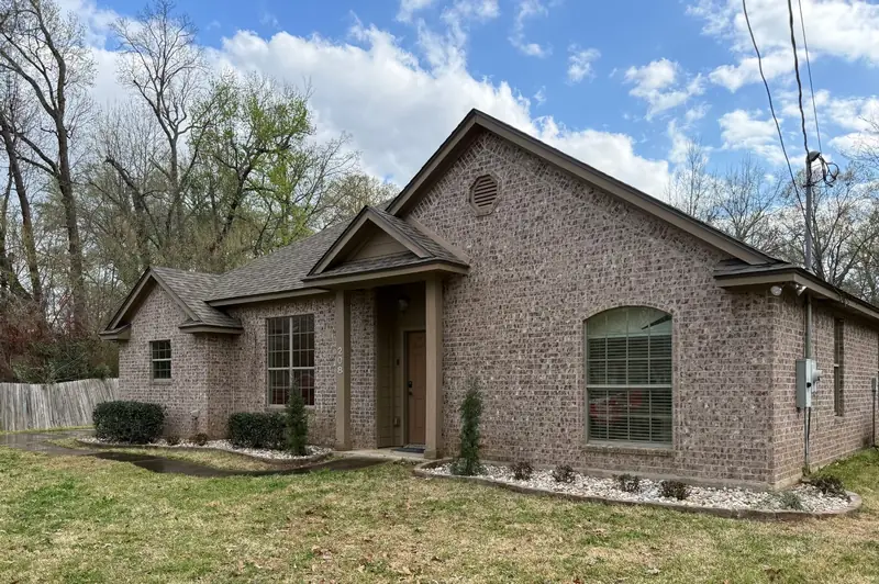 Clean front beds and fresh-cut bermuda, East Texas