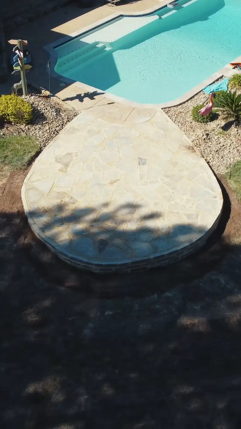 Finished flagstone patio at the end of the pool, from above, Hallsville, TX