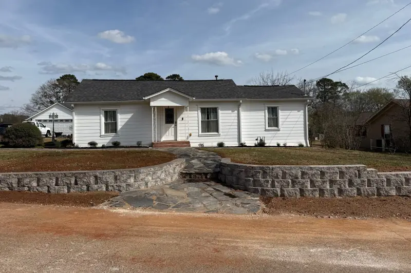 Flagstone walk between block walls, East Texas