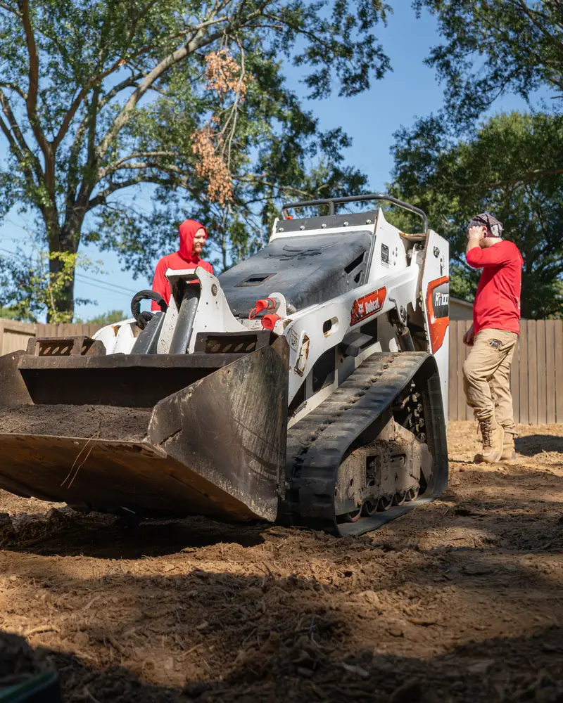 Track loader grading the yard before sod, Longview, TX