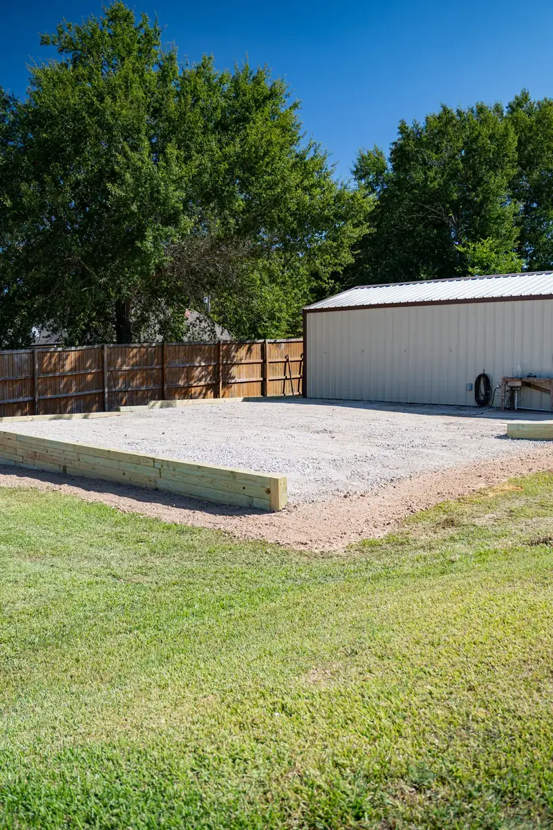 Finished boat and RV pad with timber wall and gravel, White Oak, TX