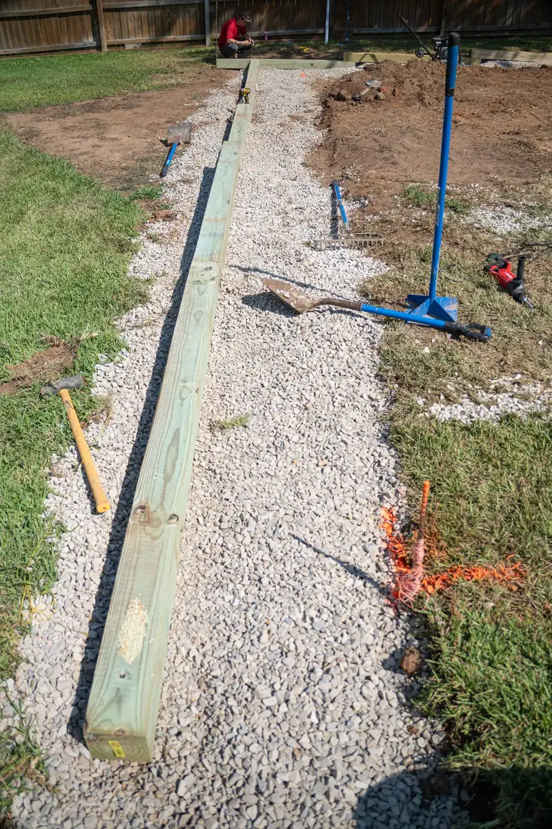 Timber wall lined up along the pad edge, White Oak, TX