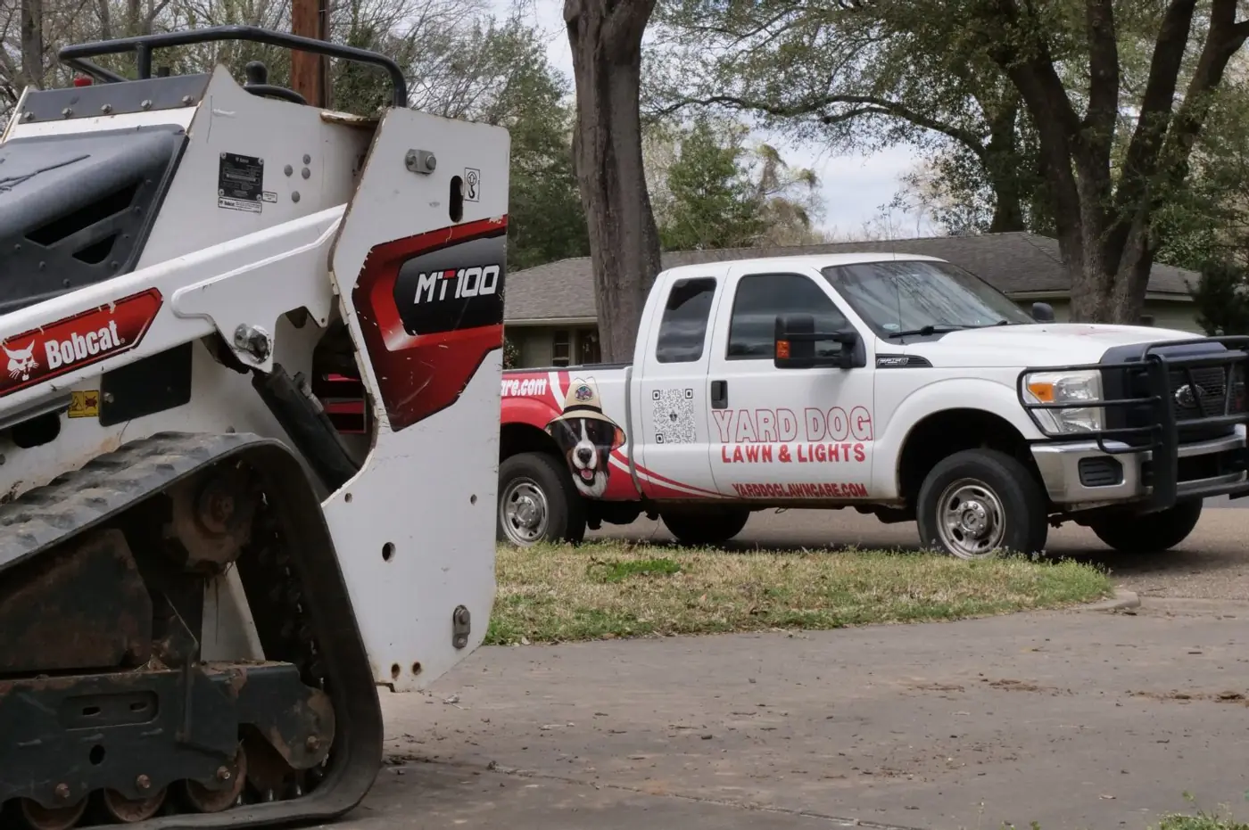 Yard Dog Landscapes truck and track loader on a job
